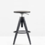 A barstool with solid oak seat and legs, swivel and with gas lift device, to easily change the height from 650 to 755 mm.