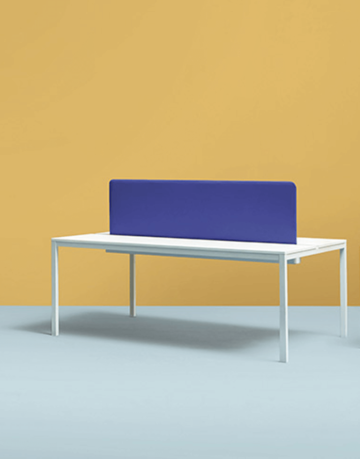 Desk with sound-absorbing partition panels.